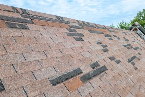 Rood in need of repair, missing shingles from storm damage